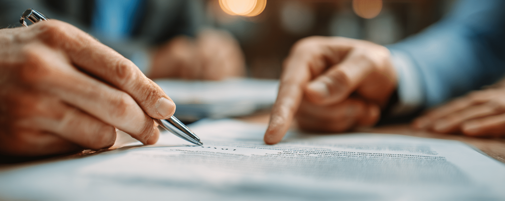 A real estate lawyer pointing at a crucial contract clause