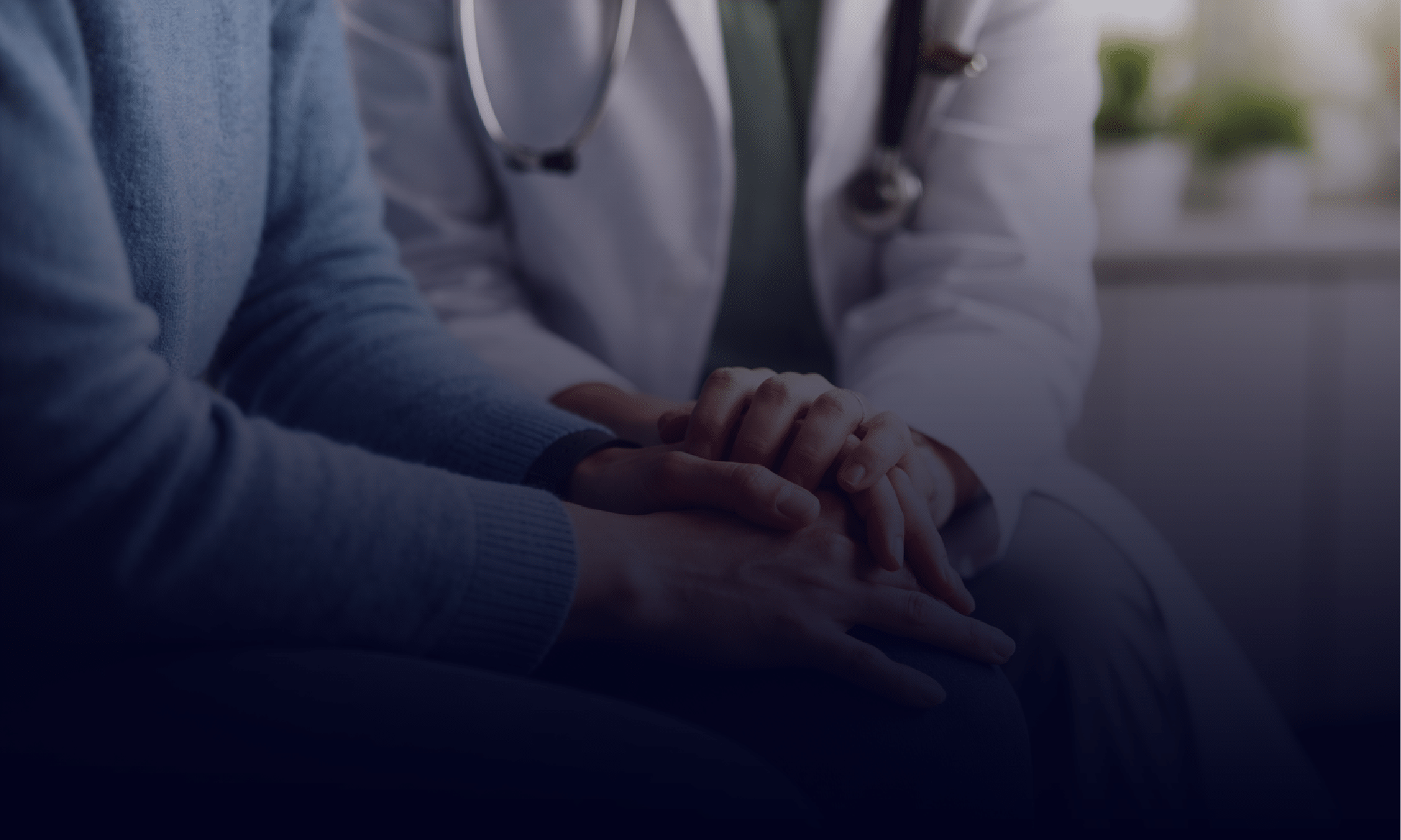 A Doctor consoling a Patient