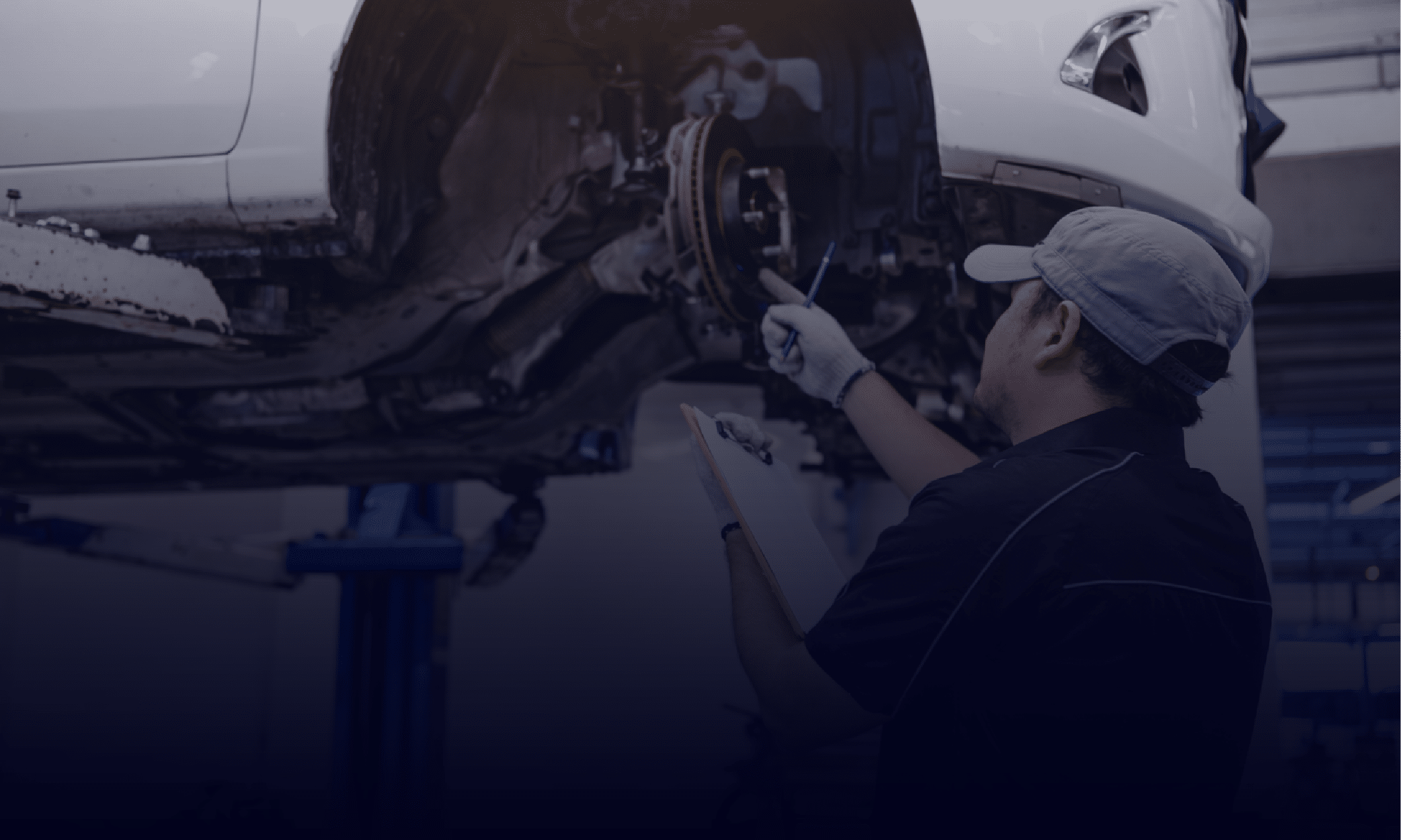 A Mechanic Repairing a Car